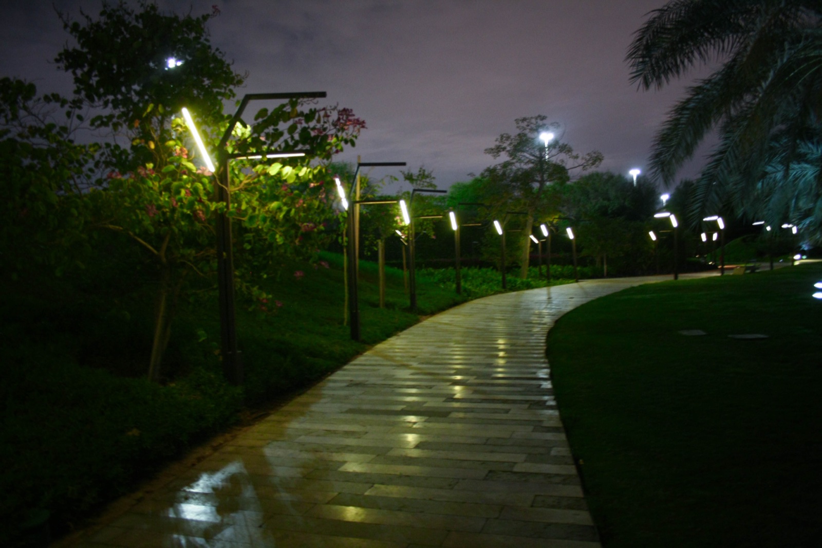 Landscaped pathway and modern structures at Al Shaheed Park